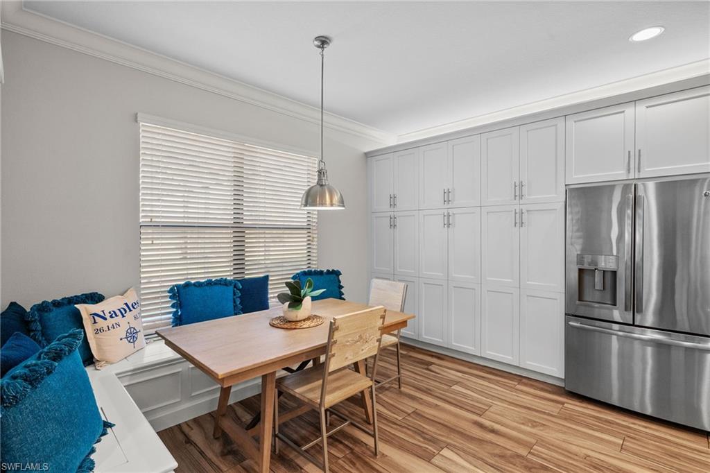 4205 Amelia Way Naples, FL 34119 - Photo 9 of 50 Large Cabinet Pantry with built in seating in breakfast area