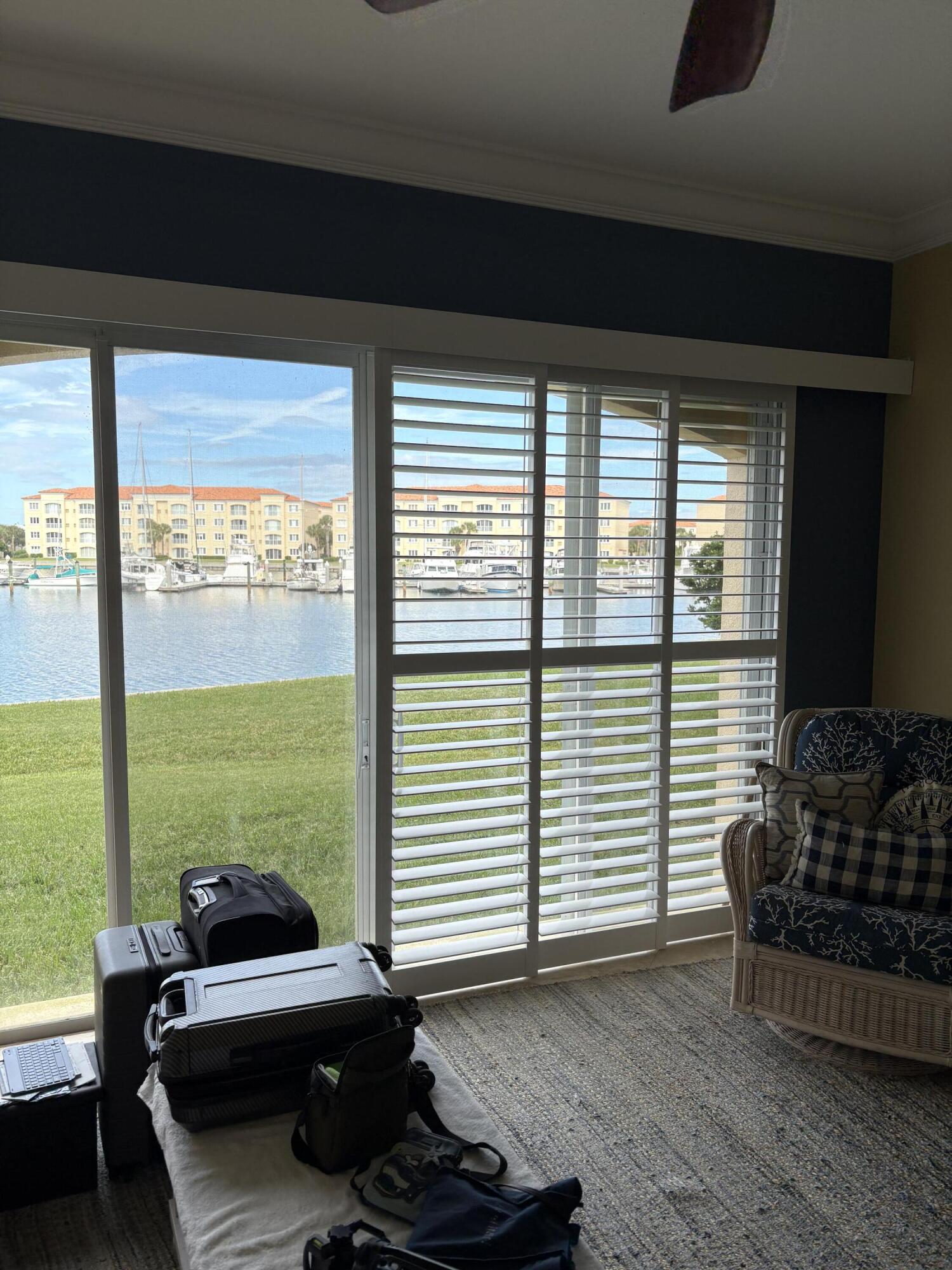 14 Harbour Isle Drive West, Unit 106 Fort Pierce, FL 34949 - Photo 13 of 23 a living room with furniture and large windows