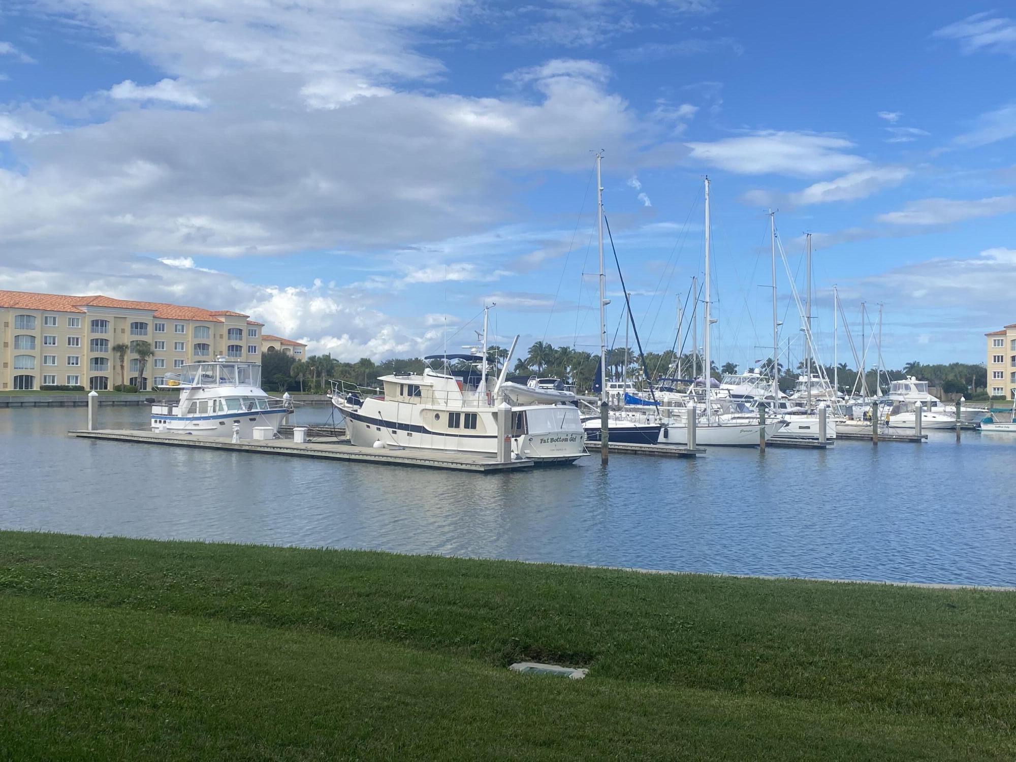14 Harbour Isle Drive West, Unit 106 Fort Pierce, FL 34949 - Photo 3 of 23 a view of a lake with a large trees