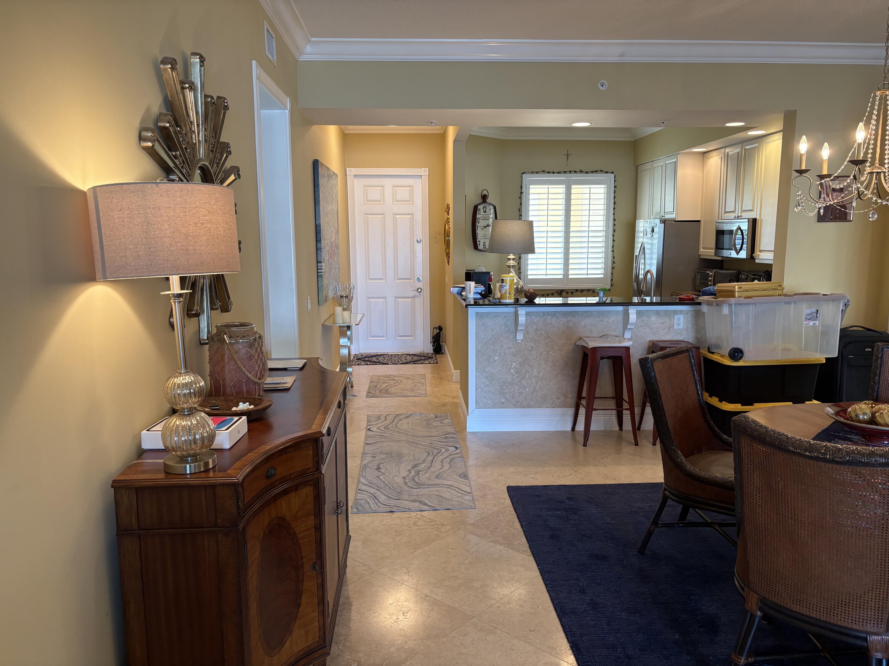 14 Harbour Isle Drive West, Unit 106 Fort Pierce, FL 34949 - Photo 7 of 23 a living room with furniture and wooden floor