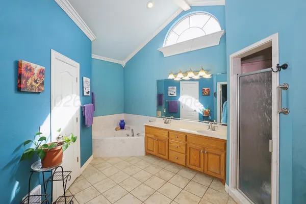 a bathroom with a sink mirror and a bath tub