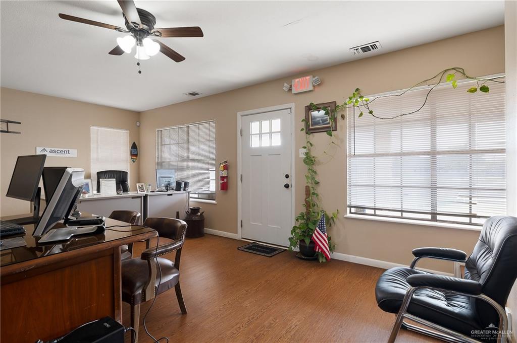 3721 North Veterans Boulevard Pharr, TX 78577 - Photo 6 of 18 Home office featuring baseboards, visible vents, a ceiling fan, and wood finished floors