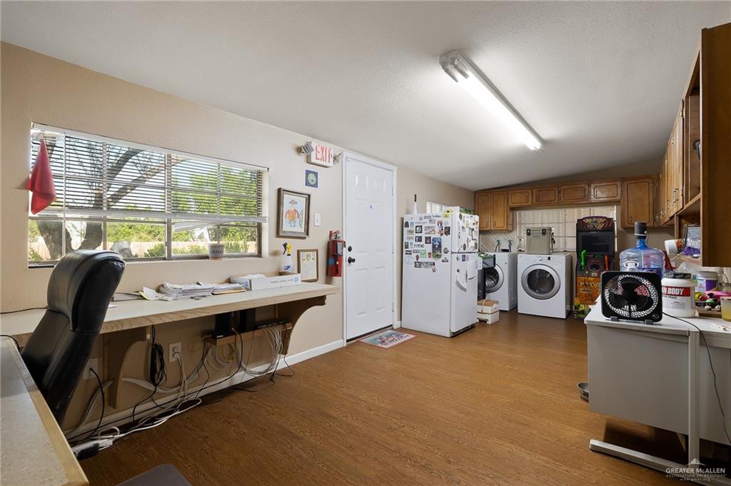 3721 North Veterans Boulevard Pharr, TX 78577 - Photo 10 of 18 Washroom featuring wood finished floors, laundry area, and washer and dryer