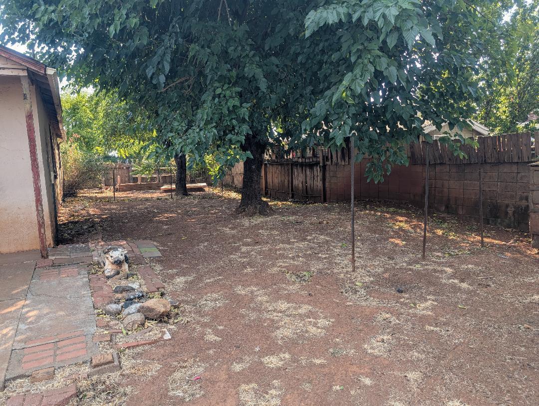1118 4th Street Redding, CA 96002 - Photo 12 of 16 a backyard of a house with lots of green space