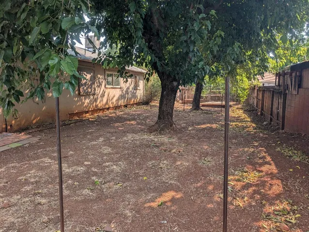 a view of a house with a tree