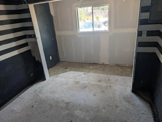 an empty room with windows