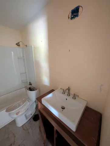 a bathroom with a sink and a bathtub
