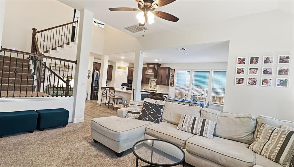 5216 Troupe Road McKinney, TX 75071 - Photo 15 of 40 Open-concept living space featuring high ceilings and a ceiling fan