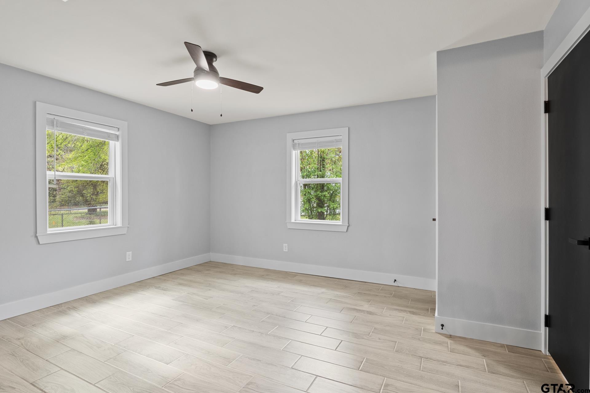 802 Quitman Street Pittsburg, TX 75686 - Photo 13 of 24 a view of an empty room with a window
