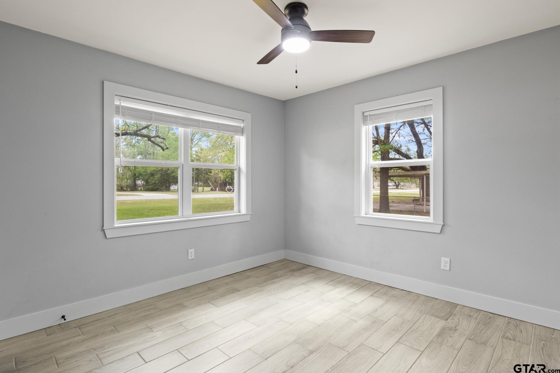802 Quitman Street Pittsburg, TX 75686 - Photo 18 of 24 a view of an empty room with a window