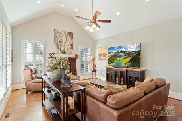 a living room with furniture a couch and a window