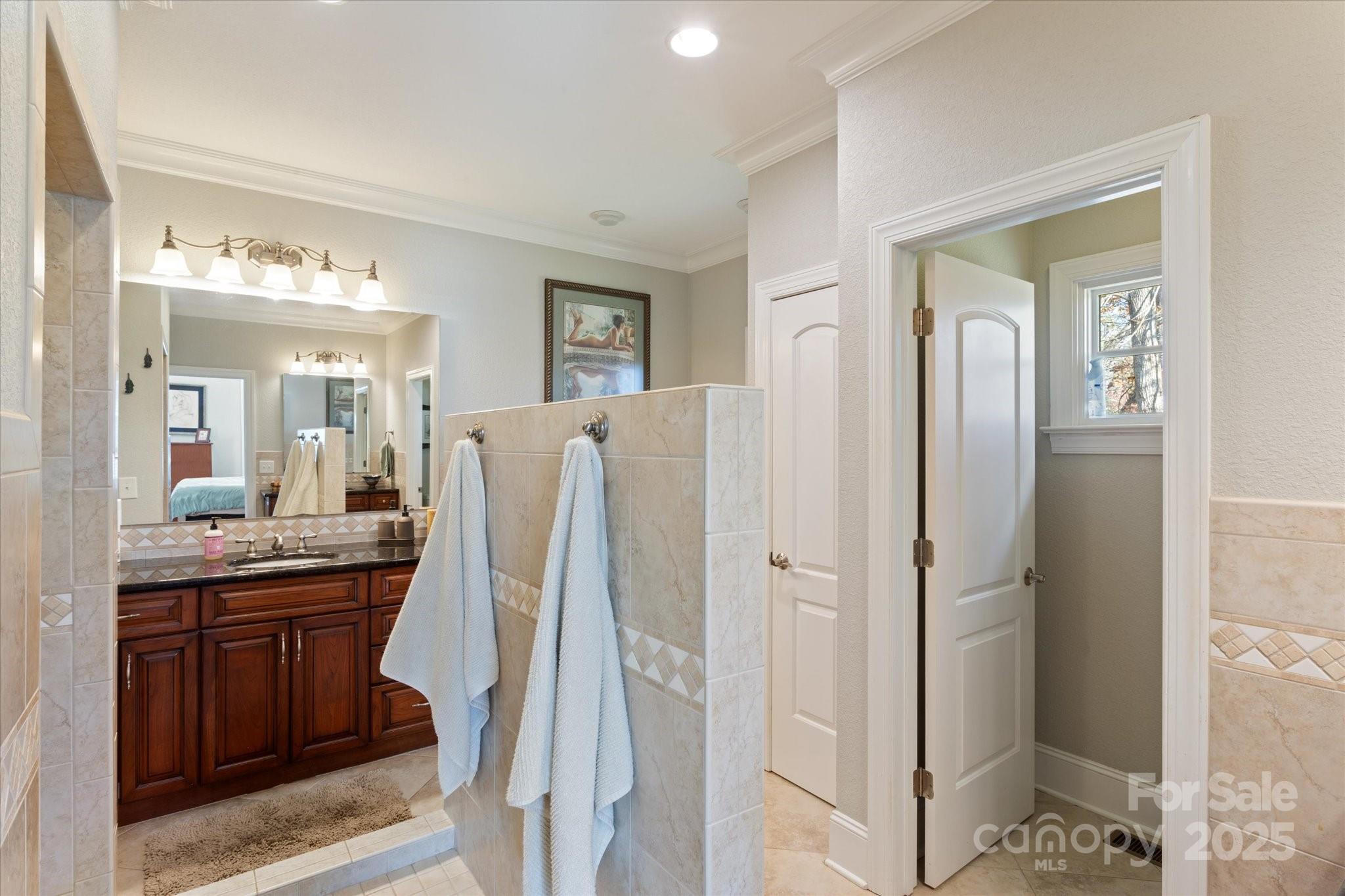 733 Plantation Dr Extension Rutherfordton, NC 28139 - Photo 18 of 34 a bathroom with a double vanity sink and mirror