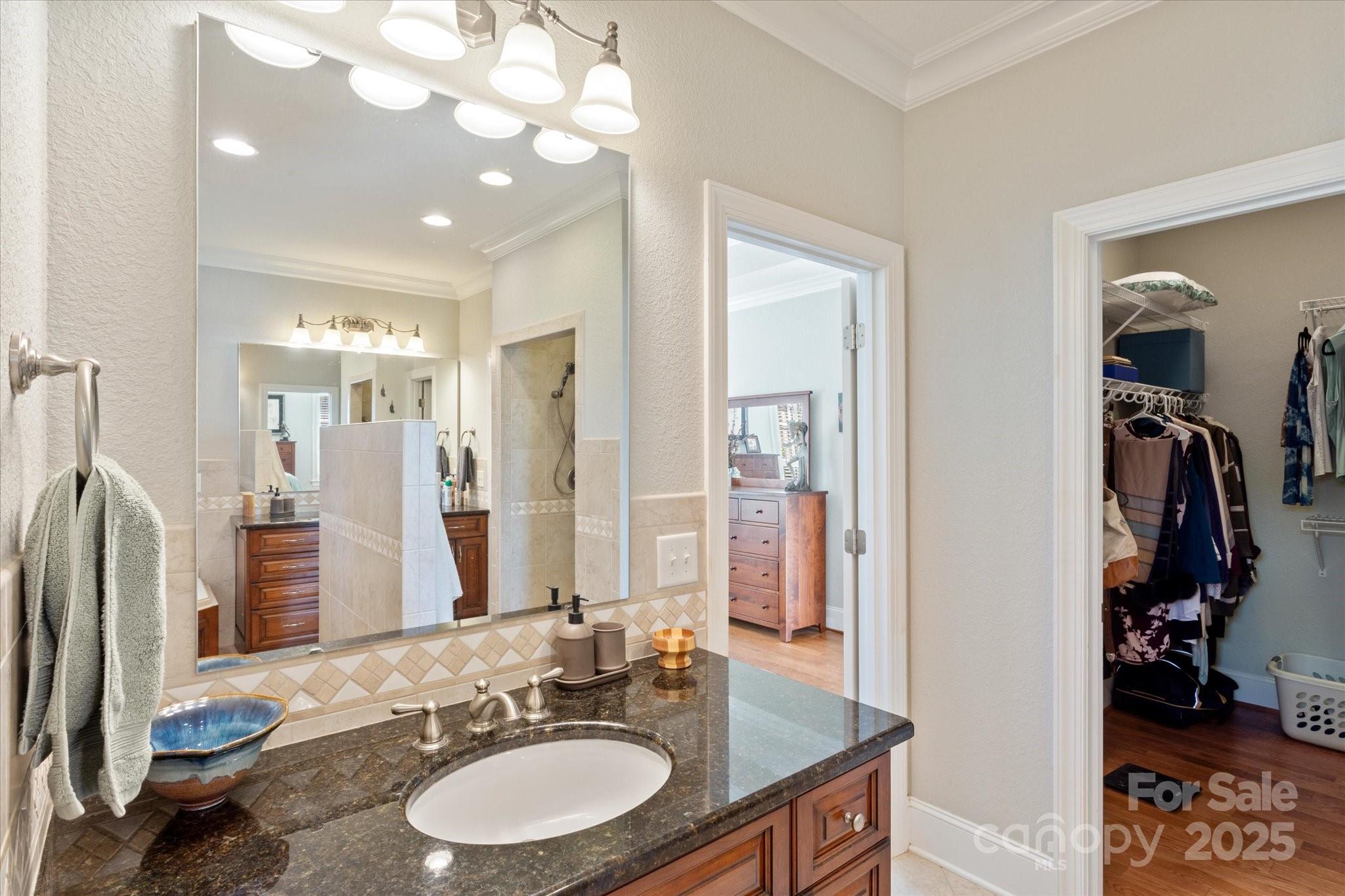 733 Plantation Dr Extension Rutherfordton, NC 28139 - Photo 20 of 34 a bathroom with a granite countertop sink and a mirror
