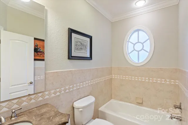 a bathroom with a toilet a sink and a bathtub