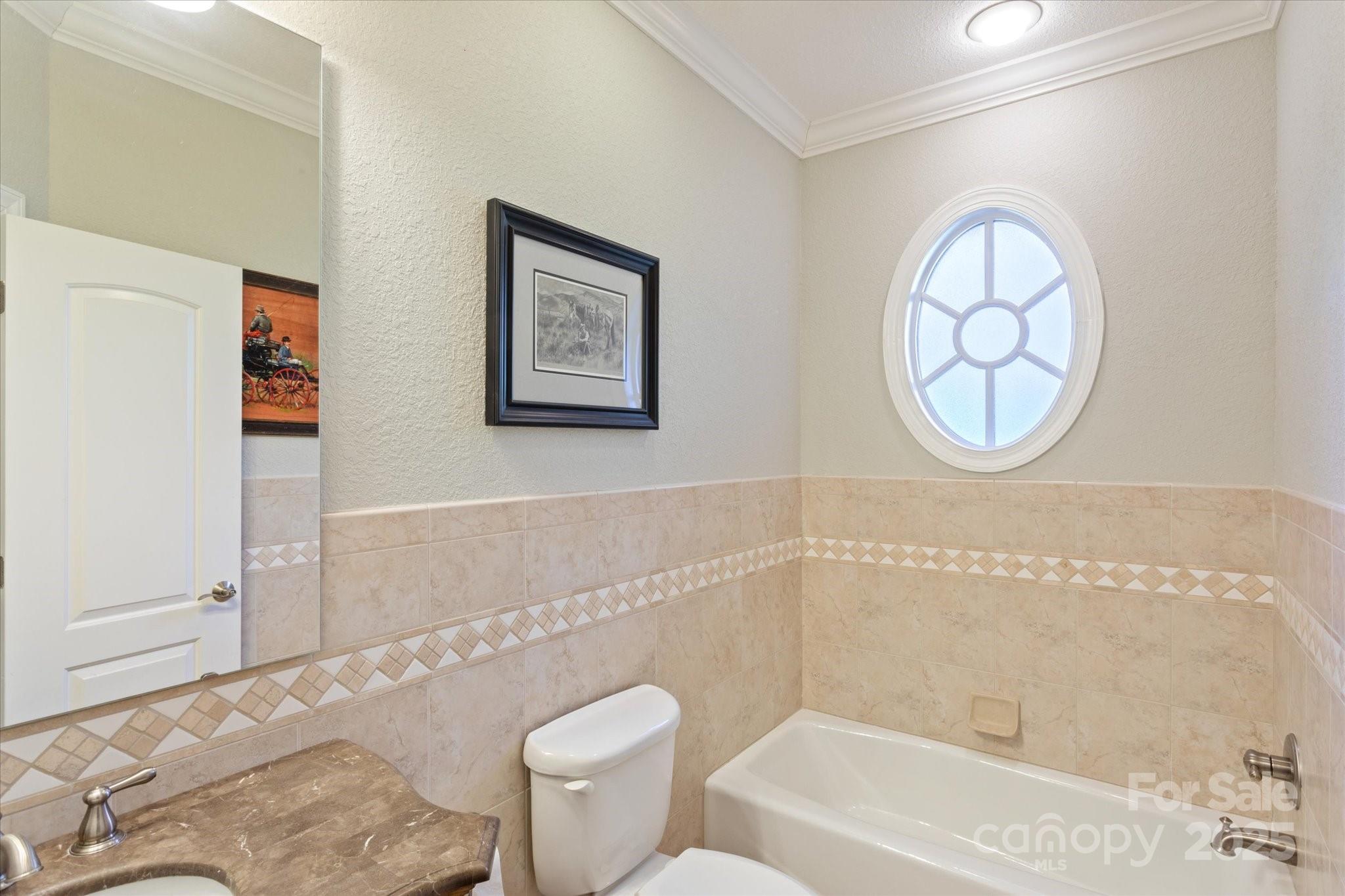 733 Plantation Dr Extension Rutherfordton, NC 28139 - Photo 25 of 34 a bathroom with a toilet a sink and a bathtub