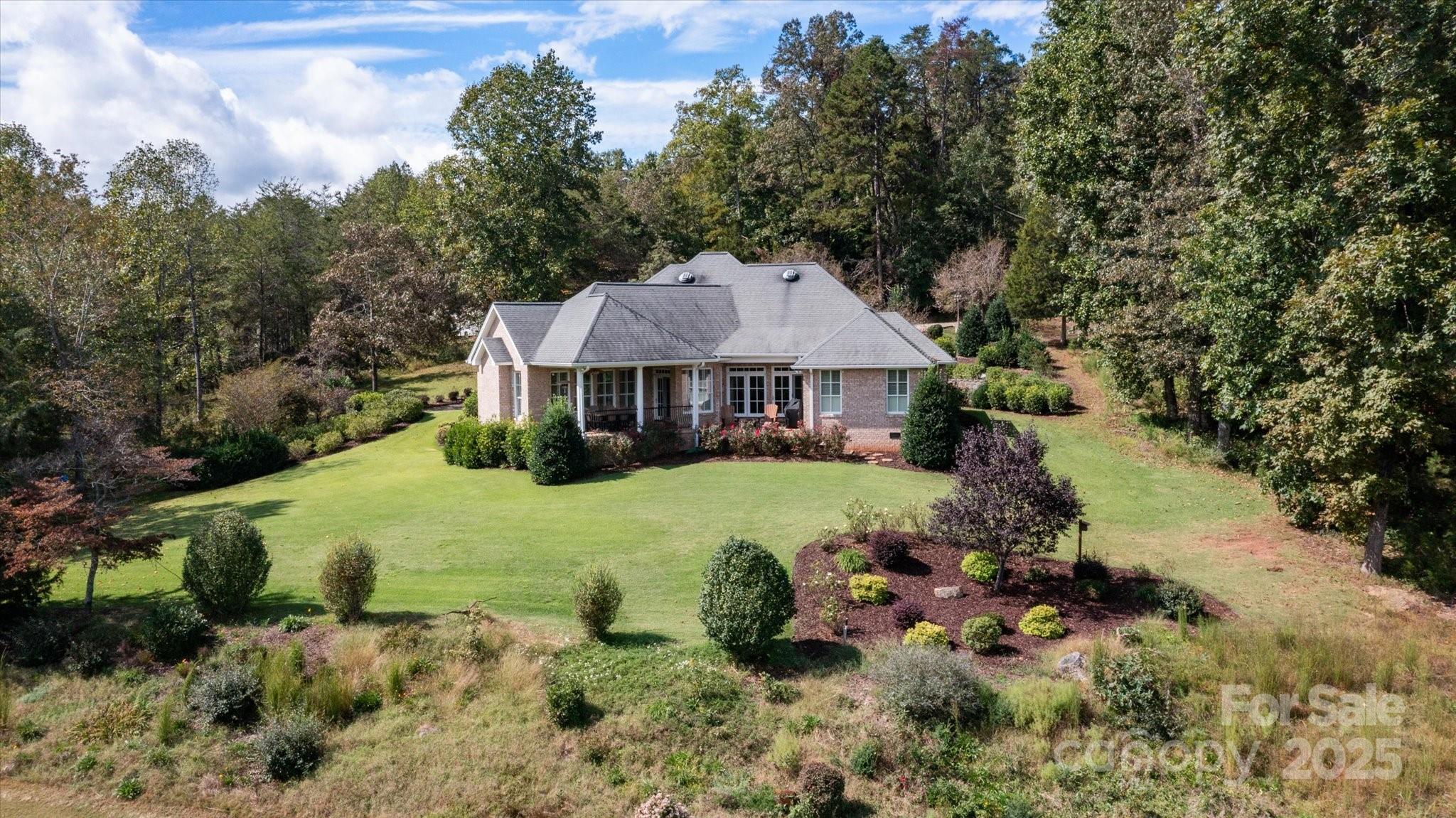 733 Plantation Dr Extension Rutherfordton, NC 28139 - Photo 5 of 34 a view of a house with swimming pool and sitting area