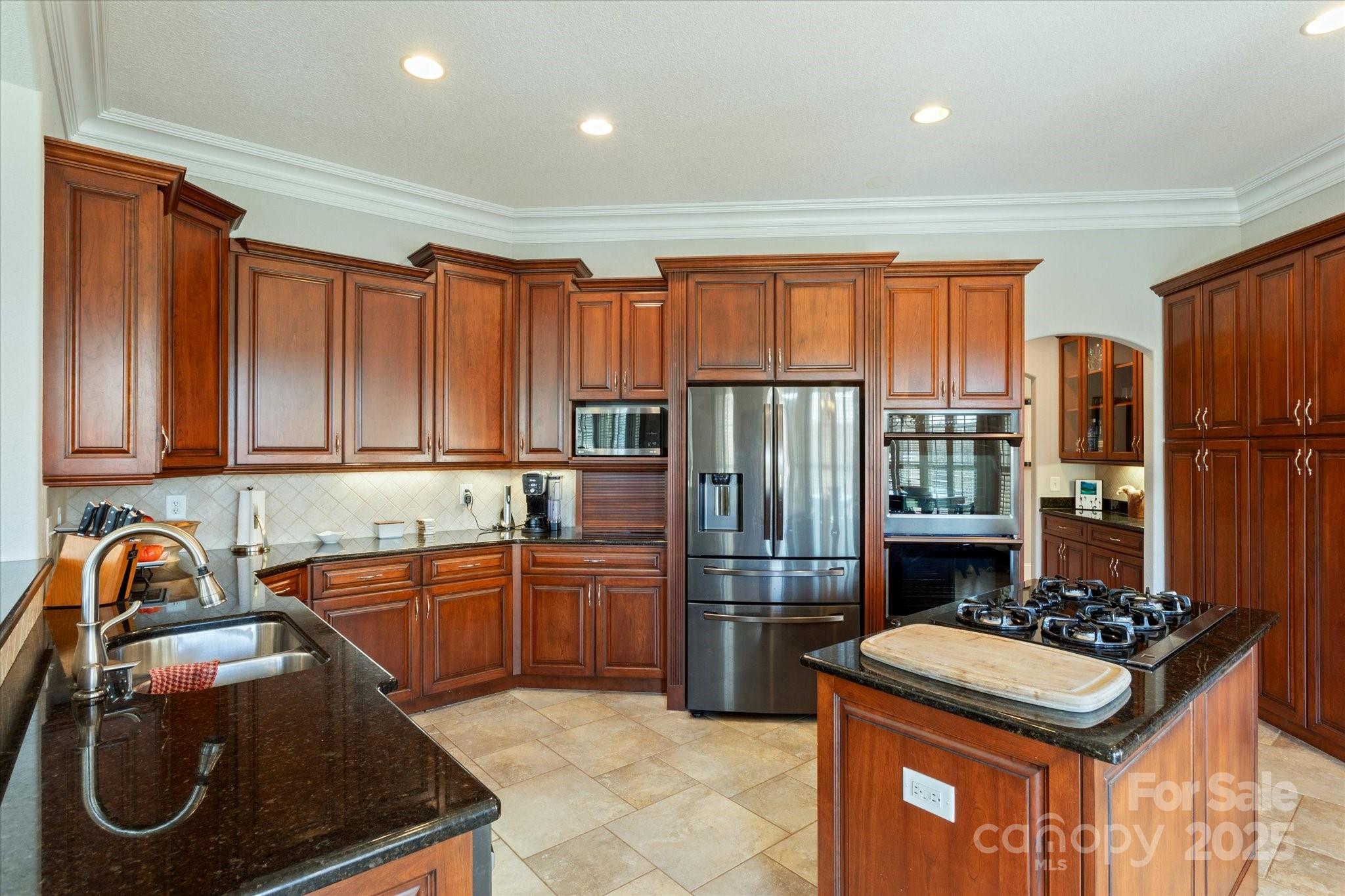 733 Plantation Dr Extension Rutherfordton, NC 28139 - Photo 9 of 34 a kitchen with stainless steel appliances granite countertop a sink stove and refrigerator