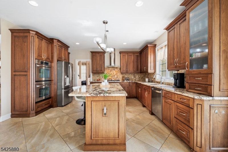 5 Rigger Court Hillsborough, NJ 08844 - Photo 14 of 42 a kitchen with stainless steel appliances granite countertop a stove a sink and a refrigerator