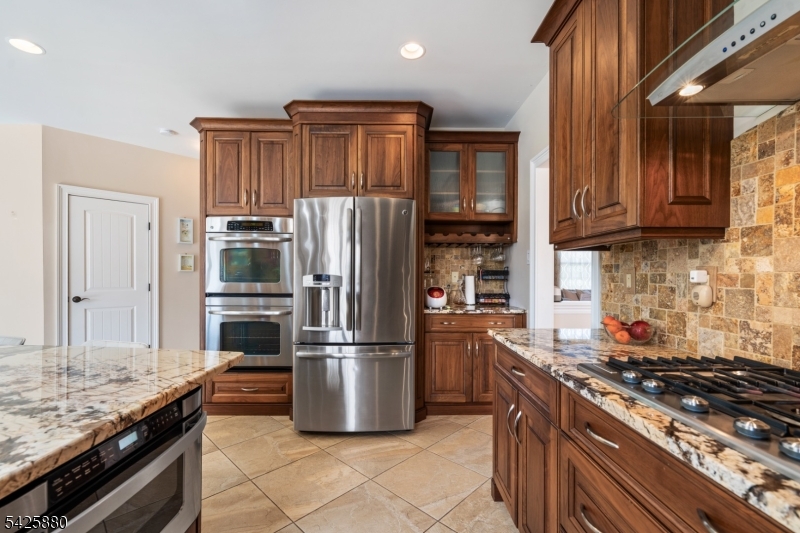 5 Rigger Court Hillsborough, NJ 08844 - Photo 16 of 42 a kitchen with stainless steel appliances granite countertop a refrigerator a stove and a sink