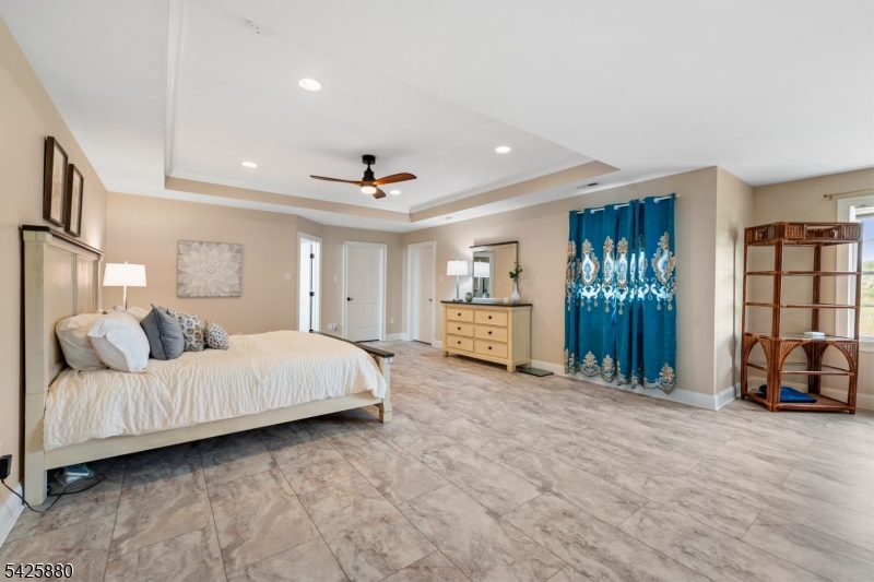 5 Rigger Court Hillsborough, NJ 08844 - Photo 22 of 42 a spacious bedroom with a bed and a view of walk in closet