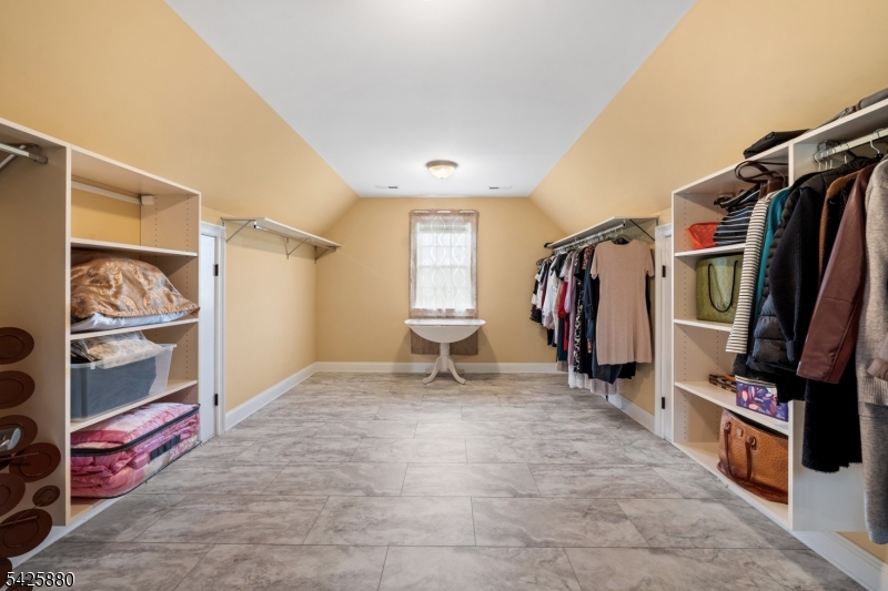 5 Rigger Court Hillsborough, NJ 08844 - Photo 25 of 42 a view of walk in closet with clothes and shoes