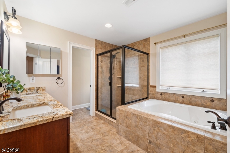 5 Rigger Court Hillsborough, NJ 08844 - Photo 26 of 42 a spacious bathroom with a granite countertop tub sink and mirror