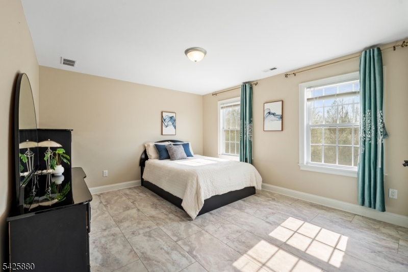 5 Rigger Court Hillsborough, NJ 08844 - Photo 29 of 42 a spacious bedroom with a bed and a window