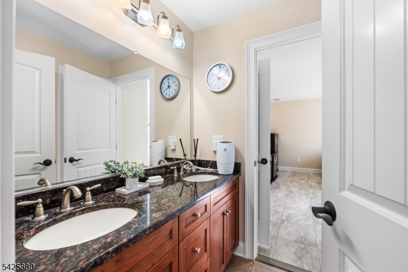 5 Rigger Court Hillsborough, NJ 08844 - Photo 31 of 42 a bathroom with a sink double vanity and a mirror