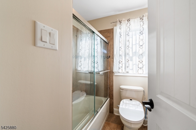 5 Rigger Court Hillsborough, NJ 08844 - Photo 32 of 42 a white toilet sitting next to a bathroom sink