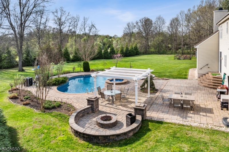 5 Rigger Court Hillsborough, NJ 08844 - Photo 4 of 42 a view of a house with backyard swimming pool and sitting area