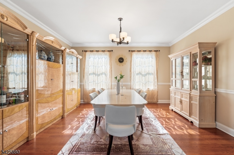 5 Rigger Court Hillsborough, NJ 08844 - Photo 9 of 42 a dining room with wooden floor a chandelier