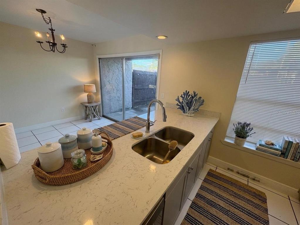 4033 Henley Road, Unit 1707 Orlando, FL 32839 - Photo 5 of 66 a kitchen with a sink and a stove