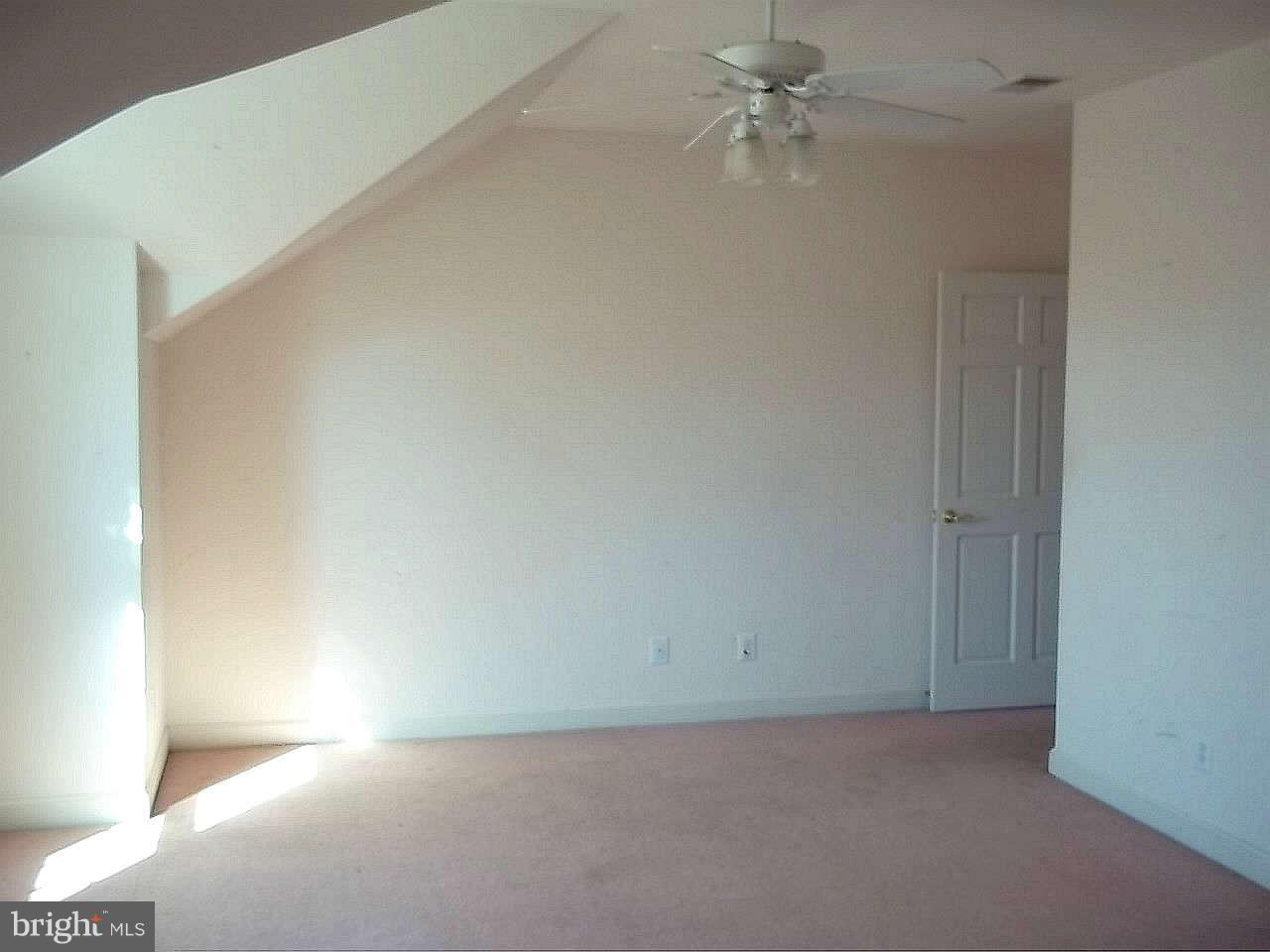10608 Brooks Reserve Road Upper Marlboro, MD 20772 - Photo 15 of 23 an empty room with a ceiling fan and a window