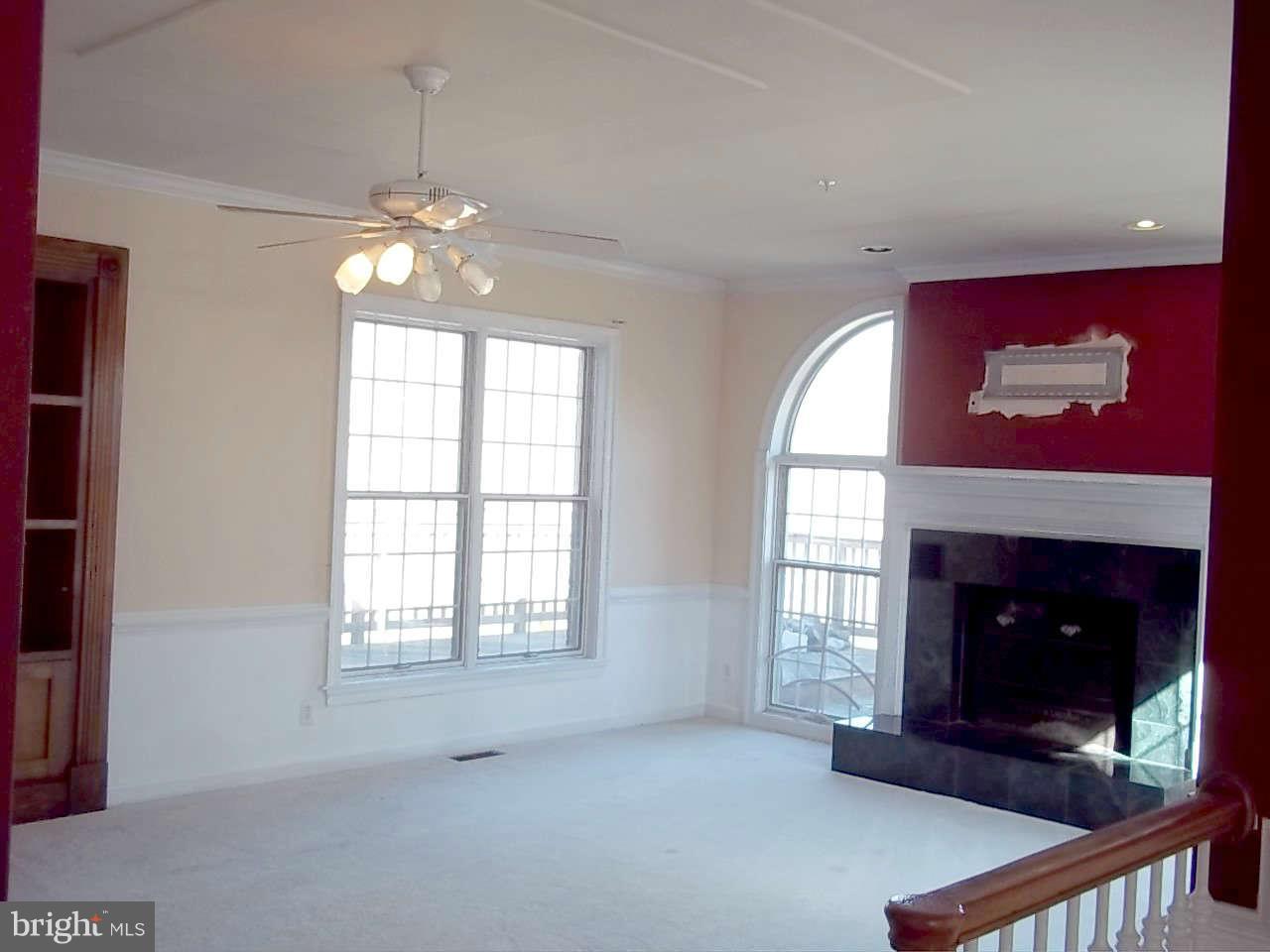 10608 Brooks Reserve Road Upper Marlboro, MD 20772 - Photo 9 of 23 wooden floor fireplace and windows in an empty room