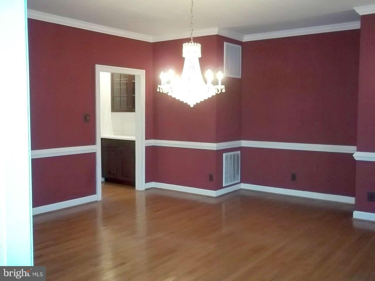 10608 Brooks Reserve Road Upper Marlboro, MD 20772 - Photo 10 of 23 a view of an empty room with window and wooden floor