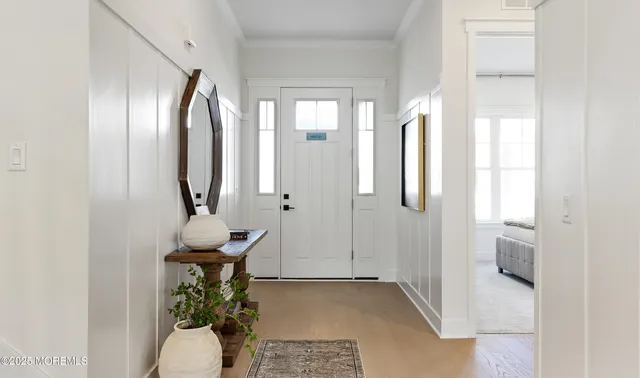 a view of a bathroom with mirror and furniture