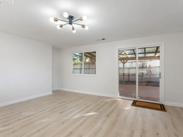 a view of kitchen with cabinets and wooden floor