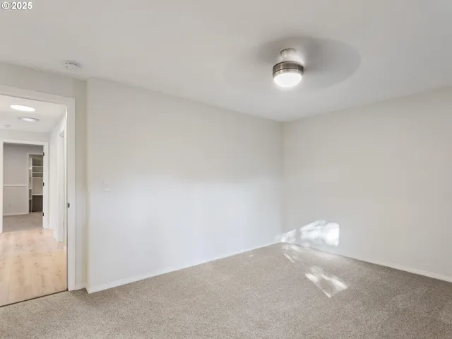 a bathroom with a toilet a sink and a mirror