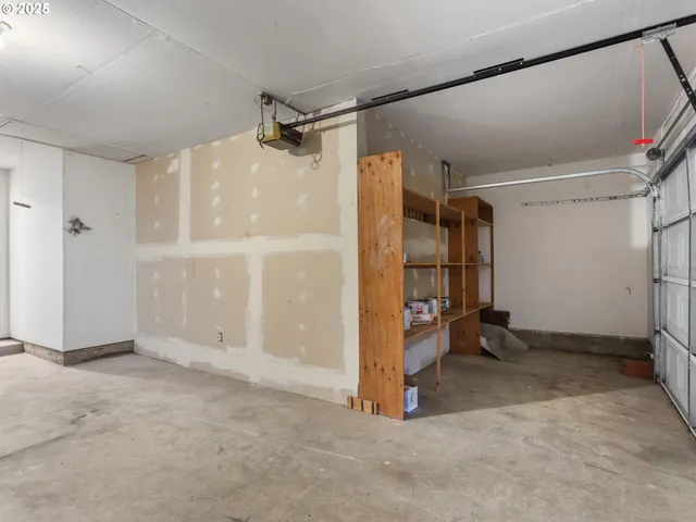 a view of a house with backyard and a tree