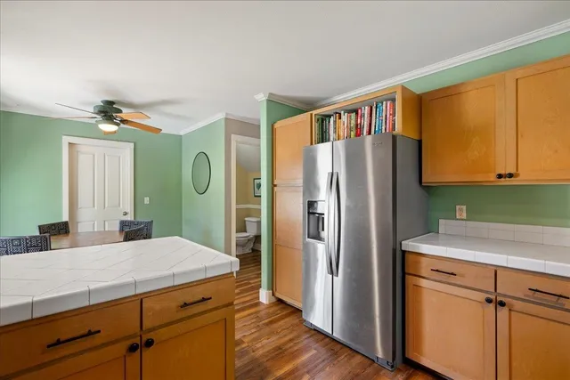 a view of a kitchen with a table and chairs