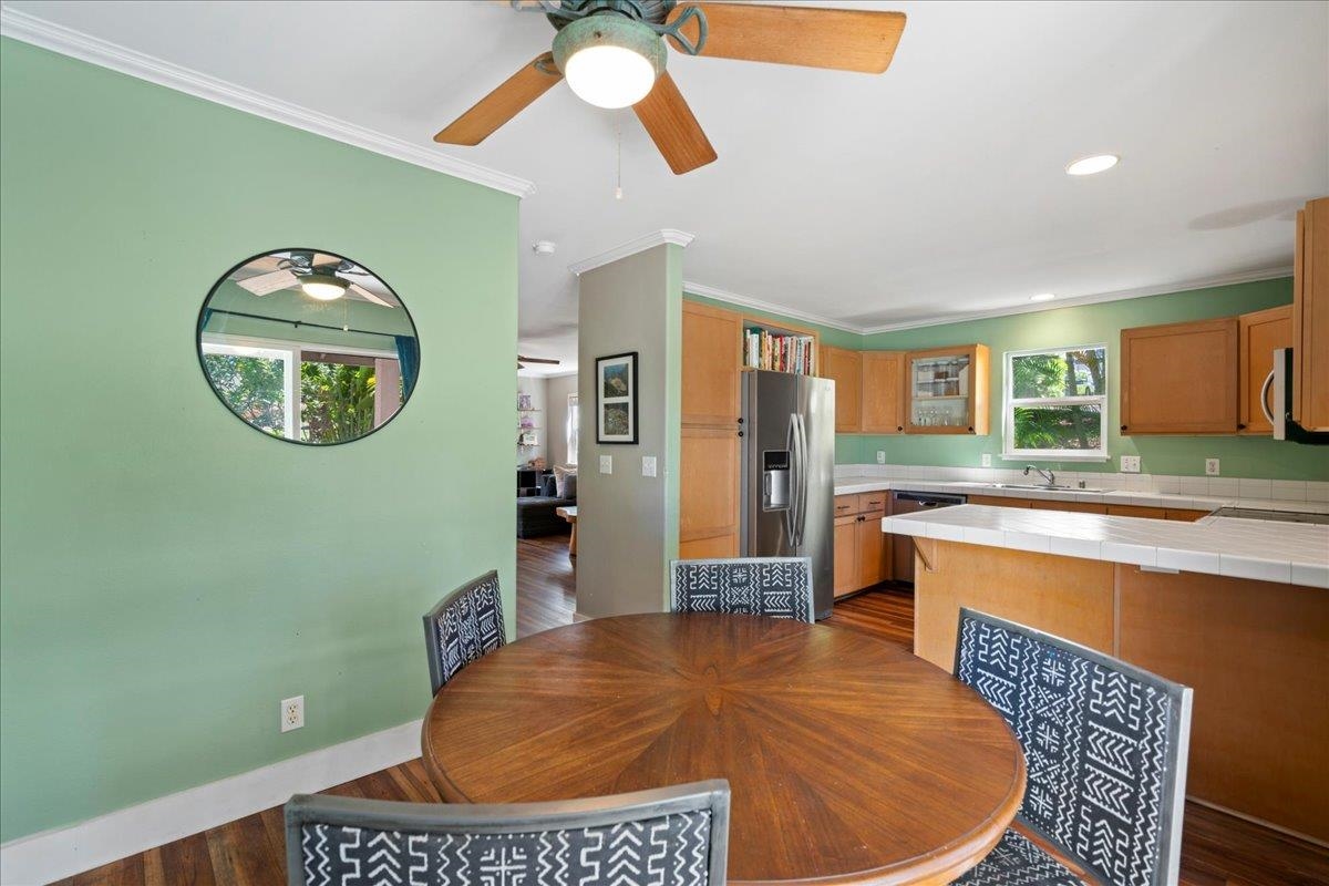 2740 Liholani Street, Unit 10 Pukalani, HI 96768 - Photo 23 of 50 a view of a kitchen with a table and chairs