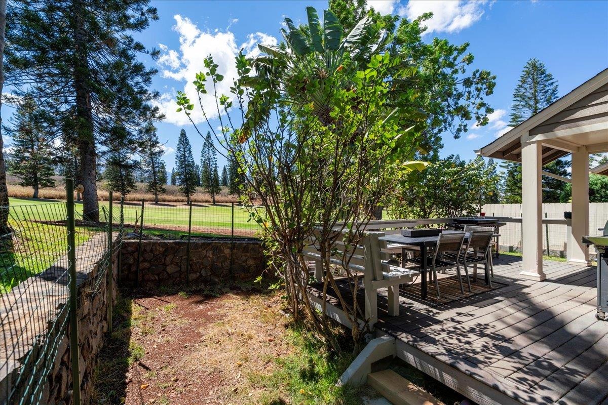 2740 Liholani Street, Unit 10 Pukalani, HI 96768 - Photo 32 of 50 a view of a patio with table and chairs and floor to ceiling window