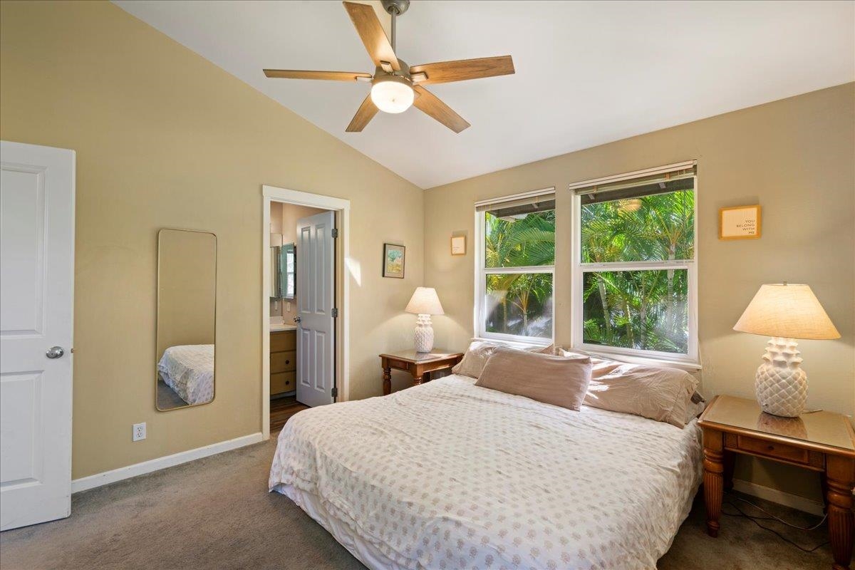 2740 Liholani Street, Unit 10 Pukalani, HI 96768 - Photo 36 of 50 a bedroom with a bed and a window