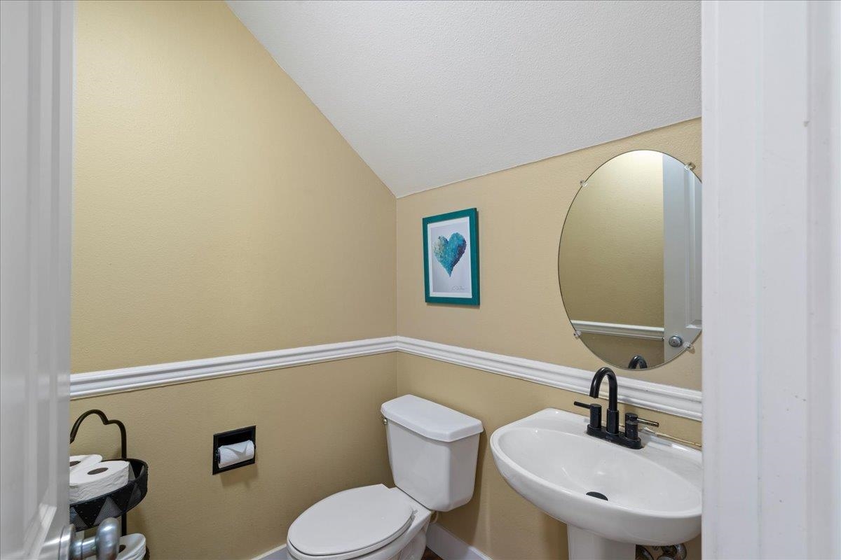 2740 Liholani Street, Unit 10 Pukalani, HI 96768 - Photo 49 of 50 a bathroom with a toilet sink and mirror