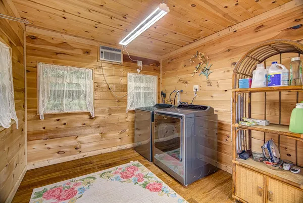 a bathroom with a tub and shower