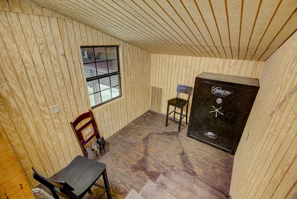 a view of a livingroom with furniture and a window