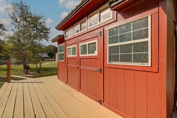 a view of house with backyard and wooden floor