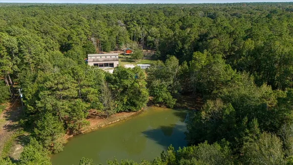 a backyard of a house with a yard and lake view