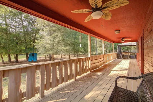 a view of a balcony with wooden floor