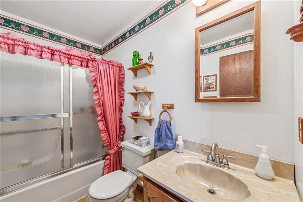 126 Wetzel Road Smock, PA 15480 - Photo 13 of 33 a bathroom with a sink toilet and shower